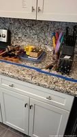 Wide view of kitchen counter with all items included in the lot