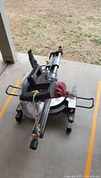 Photo showing the complete Chicago Electric miter saw with saw blade and metal base