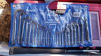 Photo showing entire 25 piece hex key set in blue plastic roll pouch, keys organized by size.