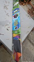 Photo of packaged Aerostar kite showing colorful 3-D star design and branding.