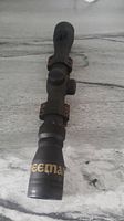 Front to back view of Beeman rifle scope with mounting rings attached