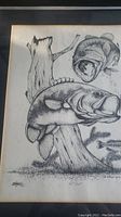 Close-up view of the print showing two largemouth bass near a tree and vegetation with fine detail line work.