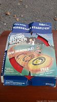 Original box for Wayne Gretzky Amazing Flying Saucer showing toy and details on front with some wear