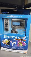 Boxed Sirius Sportster Replay satellite radio system with remote control and receiver visible through packaging.