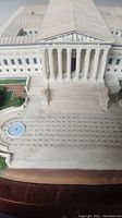 Front view of the miniature model showing the large stairs, detailed facade of the Supreme Court with columns, and base including the forecourt.