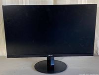 Front view of Acer 24 inch LCD monitor turned off showing slim bezels, black screen and circular stand base.