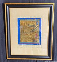 Framed original Egyptian oil painting on papyrus depicting a winged figure with hieroglyphic background, signed by artist S. Gharip.