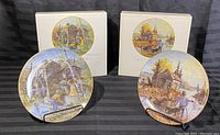 Pair of Keirstead Early Memories series collector plates with original boxes and display stands