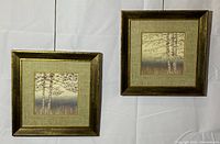 Two framed prints hanging side by side against a white backdrop showing overall size and appearance