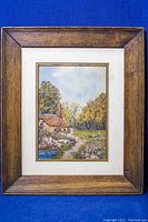 Framed watercolour painting with wood frame and white mat surrounding the image.