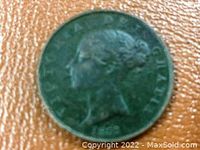 Close-up of the obverse of 1853 Great Britain Half Penny with Queen Victoria's profile and date.