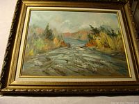 Full view of the framed painting showing the artwork and frame