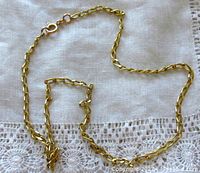 Chain laid on white fabric to show full length and link style