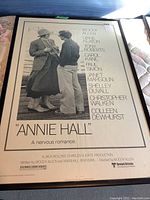 Framed original black and white 'Annie Hall' movie poster showing Woody Allen and Diane Keaton with credits and title.