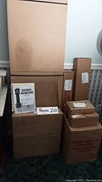 Full view of stacked cardboard boxes and assembly manual