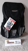 Full view of the Fieldline motorcycle backpack showing overall design, logo, and original tag.