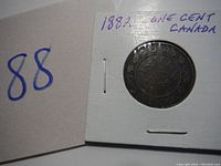 Reverse side of the 1882 Canadian one cent coin showing the year and decorative details.