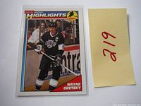 Front of 1991 O-Pee-Chee Hockey Highlights Wayne Gretzky card showing player in Los Angeles Kings uniform.