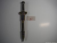 Full dagger closed in sheath showing length and overall design