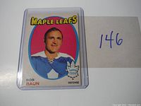 Front view of Bob Baun hockey card featuring Maple Leafs logo and player's image.