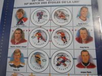 Close-up photo of commemorative NHL All-Star Game stamps featuring multiple NHL legends with Canada Post markings