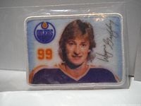 Clear full view of first Gretzky Edmonton Oilers crest patch showing his face, jersey number 99, team logo, and signature on a white bordered rectangle.