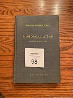Front cover photograph of the 1929 Historical Atlas by William R. Shepherd showing gold embossed title and author details on dark cloth cover.