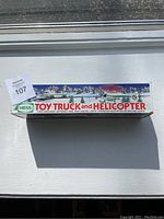 Front side of original Hess Toy Truck and Helicopter box with illustrated winter scene and product information