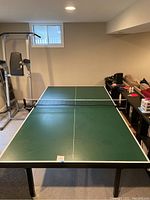 Assembled table full view from end showing green playing surface and white lines