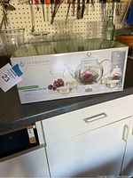 Box front showing Teabloom Celebration Flowering Tea Set with contents picture.