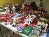 Wide view of tables filled with assorted items including figurines, trays, loose ornaments
