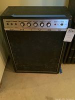 Front view of the Univox amplifier showing the brand name and the black speaker grille.