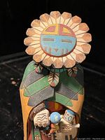 Front view full doll showing sunflower headdress and inset dancer figure