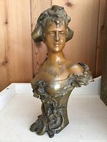 Front view of full bust showing facial features and chest details