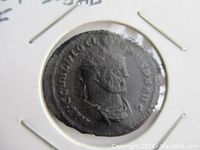 Front side of Roman coin featuring a side bust of Emperor Diocletianus with Latin inscription along edge