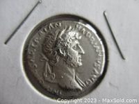 Obverse of coin showing laureate bust of Hadrian facing right in 2×2 holder