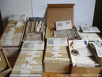 Four boxes and shoe boxes filled with envelopes and archival sleeves