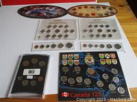 Full view of multiple Canadian coin sets including 1968, 1971, 125 Years, Millennium and Oh! Canada! sets