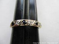 Front view of ring on mandrel showing stone arrangement