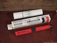 Photo of Blue Point YA10 soldering iron alongside its original box and instructions, showing packaging and tool in its closed form.