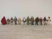 All 12 figures lined up