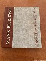 Front cover of the book showing title and religious symbols.