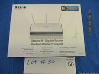 Front of box shows image of white router with dual antennas, branding D-Link, Xtreme N Gigabit Router details.