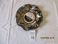 Full view of decorative scalloped plate featuring images and text from Expo 67.