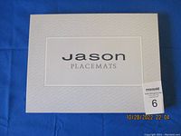Box front with brand name 'Jason Placemats' on blue background with lot quantity label of 6.