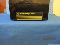 Front view of Kimberly-Clark paper towel holder with logo on the front panel.