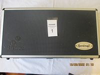 Closed view of black textured bocce ball carrying case with embossed logo and Sportcraft brand plaque.