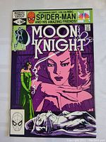 Full front cover of Moon Knight comic book issue 14 showing the main artwork and branding.