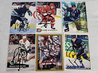 Front images of six autographed vintage hockey cards showing players and signatures clearly.