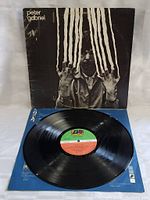 View of vinyl record with original colored label from Atlantic Records on blue inner sleeve.